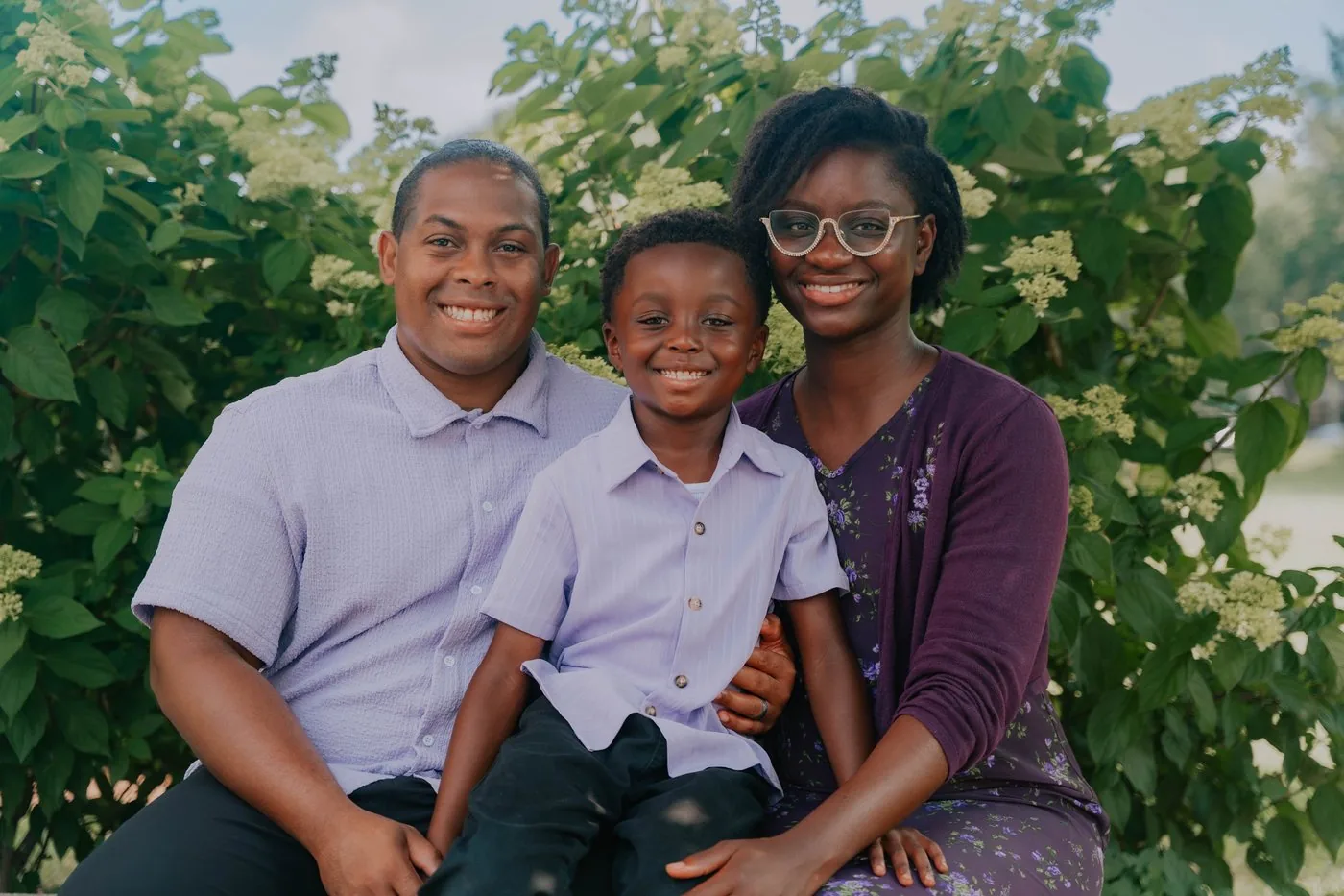 Family portrait surrounded by greenery