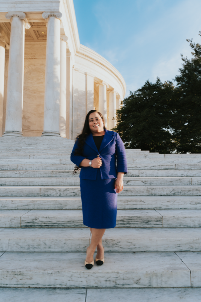 Professional headshot portrait in front of a landmark