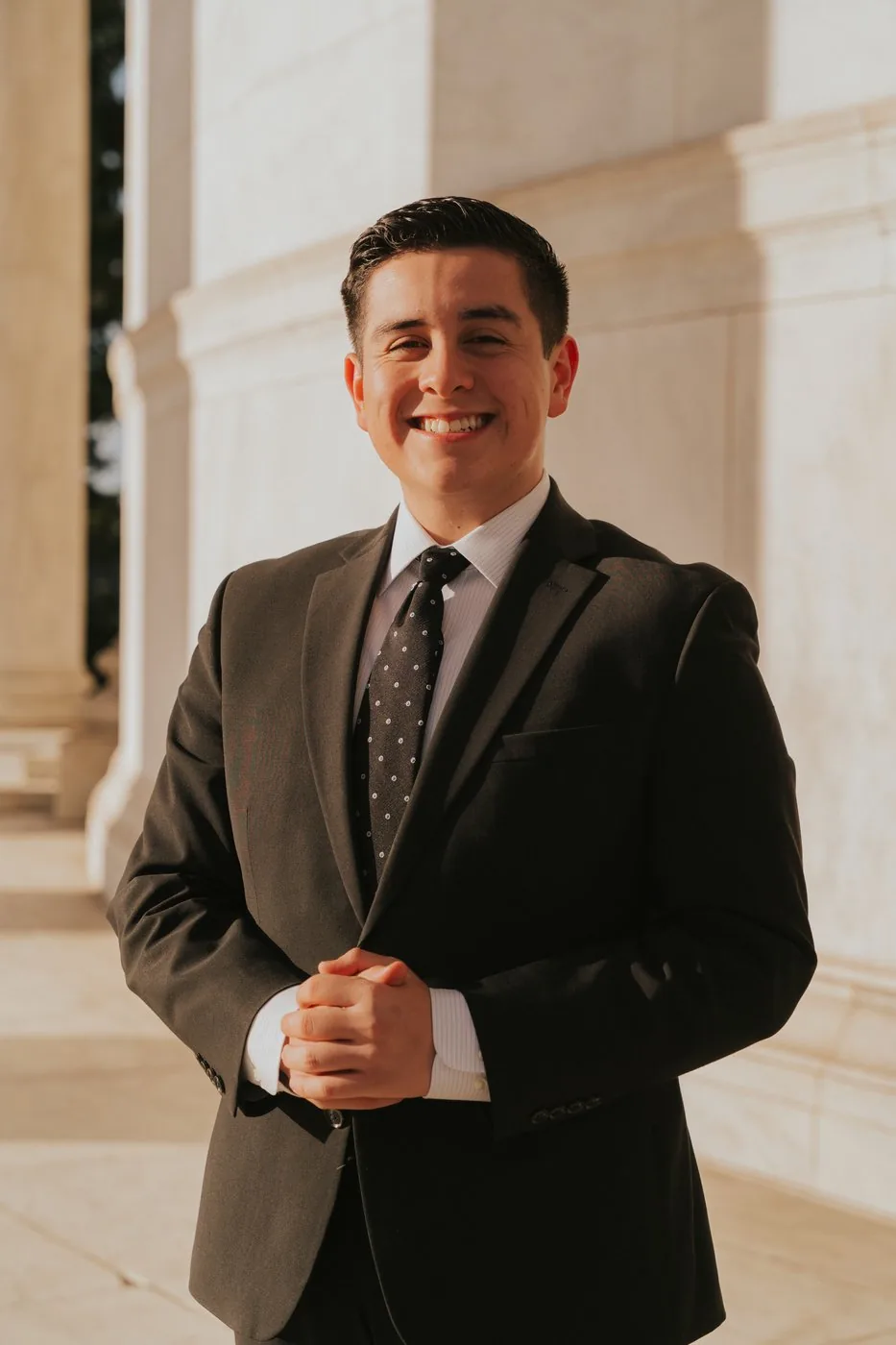 Professional headshot portrait in front of a landmark