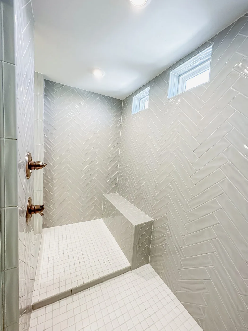 Modern shower with herringbone tile